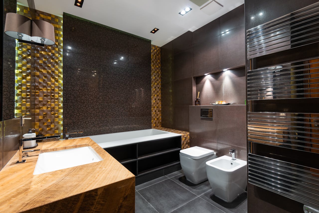 Stylish and contemporary bathroom interior with modern fixtures and unique tile design.